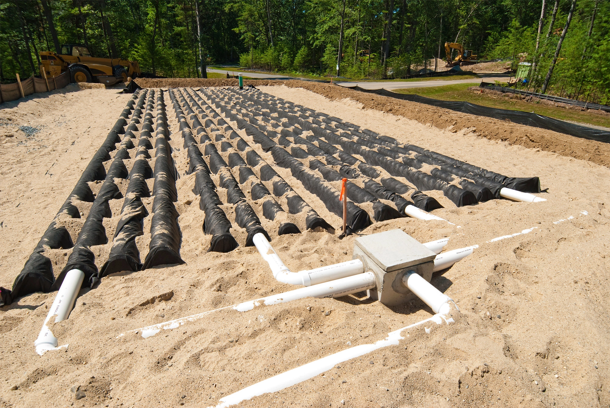 Septic system drain field installed in excavated land