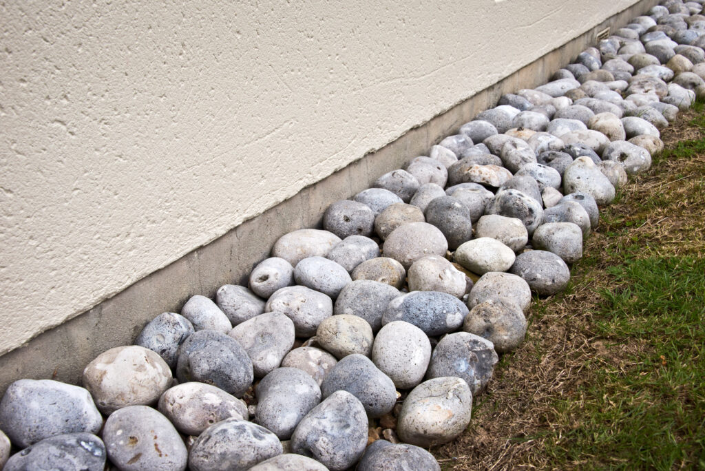 Drainage ditch with stone aggregates.